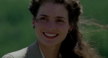 Movie still from “Legends of the Fall” (1994), directed by Edward Zwick – A person smiling; Close Up shot, Low angle