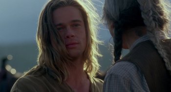 Movie still from “Legends of the Fall” (1994), directed by Edward Zwick – A man with long blonde hair standing next to a woman; Close Up shot, Over the shoulder angle