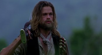 Movie still from “Legends of the Fall” (1994), directed by Edward Zwick – A man with long hair and a long beard; Close Up shot, Low angle