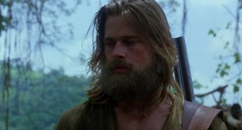 Movie still from “Legends of the Fall” (1994), directed by Edward Zwick – A man with long hair and a long beard; Close Up shot, Low angle
