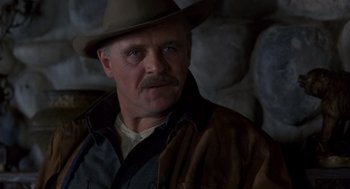 Movie still from “Legends of the Fall” (1994), directed by Edward Zwick – A person wearing a hat; Close Up shot, Low angle