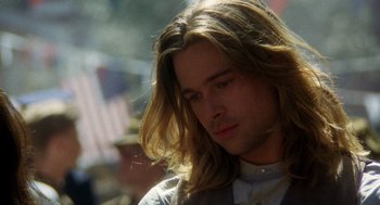 Movie still from “Legends of the Fall” (1994), directed by Edward Zwick – A person with long blonde hair; Close Up shot, Over the shoulder angle