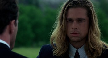Movie still from “Legends of the Fall” (1994), directed by Edward Zwick – A person wearing a suit and tie; Close Up shot, Over the shoulder angle