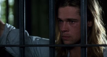 Movie still from “Legends of the Fall” (1994), directed by Edward Zwick – A person behind a fence; Close Up shot, Low angle
