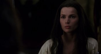 Movie still from “Legends of the Fall” (1994), directed by Edward Zwick – A woman with long black hair stares into the camera; Close Up shot, Over the shoulder angle