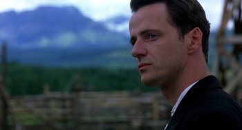 Movie still from “Legends of the Fall” (1994), directed by Edward Zwick – A person wearing a suit and tie; Close Up shot, Low angle