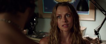 Movie still from “Lights Out” (2016), directed by David F. Sandberg – A beautiful woman with long brown hair and blue eyes looking at the camera; Close Up shot, Over the shoulder angle