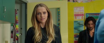 Movie still from “Lights Out” (2016), directed by David F. Sandberg – A beautiful young woman with long blonde hair; Close Up shot, Over the shoulder angle