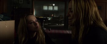 Movie still from “Lights Out” (2016), directed by David F. Sandberg – Two women sitting in a dark room talking to each other; Close Up shot, Over the shoulder angle