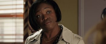 Movie still from “Lights Out” (2016), directed by David F. Sandberg – A person with short hair wearing a jacket; Close Up shot, Over the shoulder angle