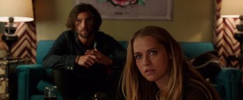 Movie still from “Lights Out” (2016), directed by David F. Sandberg – A man and a woman sitting next to each other in a room; Close Up shot, Low angle