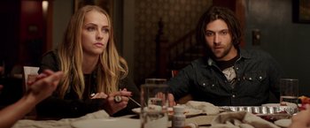Movie still from “Lights Out” (2016), directed by David F. Sandberg – A man and a woman sitting at a dinner table; Medium shot, Over the shoulder angle