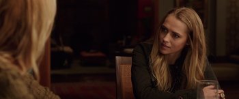 Movie still from “Lights Out” (2016), directed by David F. Sandberg – A woman sitting in a chair with her head resting on her arm; Close Up shot, Over the shoulder angle