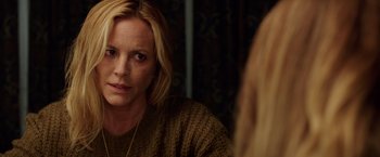 Movie still from “Lights Out” (2016), directed by David F. Sandberg – A woman looking at her reflection in a mirror; Close Up shot, Over the shoulder angle