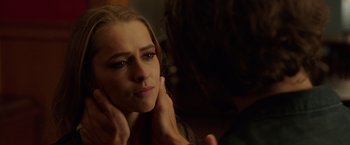 Movie still from “Lights Out” (2016), directed by David F. Sandberg – A woman sitting in front of a mirror with her hands on her face; Close Up shot, Over the shoulder angle