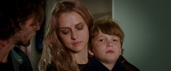 Movie still from “Lights Out” (2016), directed by David F. Sandberg – A woman and a boy are crying; Close Up shot, Low angle