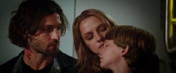 Movie still from “Lights Out” (2016), directed by David F. Sandberg – A man and a woman and a child; Close Up shot, Over the shoulder angle