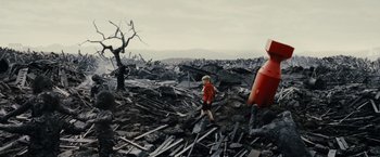 Movie still from “Little Boy” (2015), directed by Alejandro Monteverde – A person walking through a pile of debris; Extreme Wide shot, Low angle