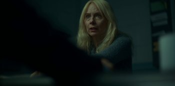 Movie still from “Lost Girls” (2020), directed by Liz Garbus – A woman sitting in front of a computer monitor; Close Up shot, Over the shoulder angle