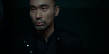 Movie still from “Lost Girls” (2020), directed by Liz Garbus – A person wearing a black shirt; Close Up shot, Low angle