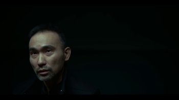 Movie still from “Lost Girls” (2020), directed by Liz Garbus – A person wearing a suit and tie; Close Up shot, Low angle