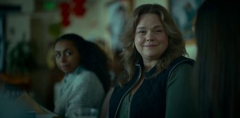 Movie still from “Lost Girls” (2020), directed by Liz Garbus – A woman standing next to another woman in a room; Close Up shot, Over the shoulder angle