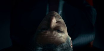 Movie still from “Lost Girls” (2020), directed by Liz Garbus – An old man with a beard is looking upward; Extreme Close Up shot, Low angle