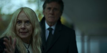 Movie still from “Lost Girls” (2020), directed by Liz Garbus – A man and a woman standing next to each other; Close Up shot, Over the shoulder angle