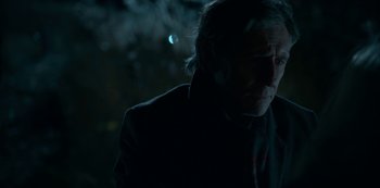 Movie still from “Lost Girls” (2020), directed by Liz Garbus – An older man in a black jacket is looking at the camera; Close Up shot, Over the shoulder angle
