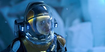 Movie still from “Lost in Space” (2018), created by Irwin Allen – A man in a space suit with a helmet on his head; Close Up shot, Over the shoulder angle