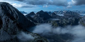 Movie still from “Lost in Space” (2018), created by Irwin Allen – A view of a mountain range in the middle of the day; Extreme Wide shot, High angle