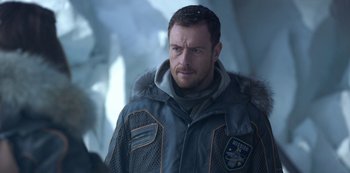 Movie still from “Lost in Space” (2018), created by Irwin Allen – A person wearing a jacket; Close Up shot, Over the shoulder angle