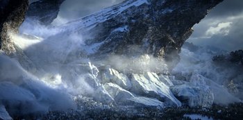 Movie still from “Lost in Space” (2018), created by Irwin Allen – A mountain with a lot of smoke coming from it; Extreme Wide shot, High angle