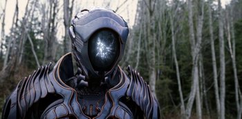 Movie still from “Lost in Space” (2018), created by Irwin Allen – A person in a suit with a helmet on; Close Up shot, Over the shoulder angle