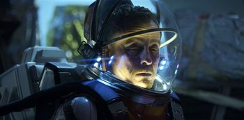Movie still from “Lost in Space” (2018), created by Irwin Allen – A person wearing a space suit; Close Up shot, Low angle