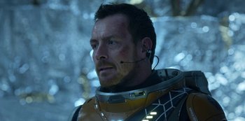 Movie still from “Lost in Space” (2018), created by Irwin Allen – A person wearing a space suit; Close Up shot, Over the shoulder angle