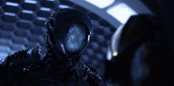 Movie still from “Lost in Space” (2018), created by Irwin Allen – The head of a robot; Close Up shot, Low angle