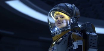 Movie still from “Lost in Space” (2018), created by Irwin Allen – A young boy wearing a space suit and helmet; Medium shot, Low angle