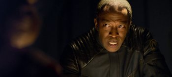 Movie still from “Lost in Space” (2018), created by Irwin Allen – A person wearing a leather jacket; Close Up shot, Over the shoulder angle