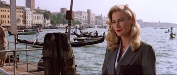 Movie still from “Indiana Jones and the Last Crusade” (1989), directed by Steven Spielberg – A woman standing in front of a body of water; Medium shot, Low angle