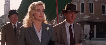 Movie still from “Indiana Jones and the Last Crusade” (1989), directed by Steven Spielberg – A man and a woman standing next to each other; Medium shot, Low angle