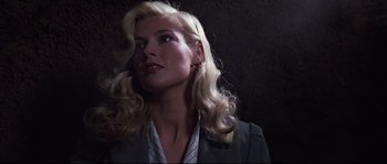Movie still from “Indiana Jones and the Last Crusade” (1989), directed by Steven Spielberg – A woman with long blonde hair wearing a jacket; Close Up shot, Low angle