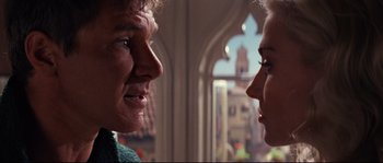 Movie still from “Indiana Jones and the Last Crusade” (1989), directed by Steven Spielberg – A man and a woman face to face in a building; Close Up shot, Over the shoulder angle