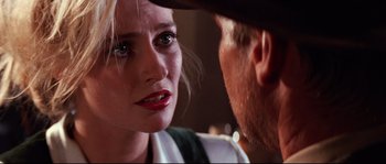Movie still from “Indiana Jones and the Last Crusade” (1989), directed by Steven Spielberg – A man and a woman looking at one another; Close Up shot, Over the shoulder angle