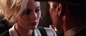 Movie still from “Indiana Jones and the Last Crusade” (1989), directed by Steven Spielberg – A man and a woman face to face in front of a mirror; Close Up shot, Over the shoulder angle