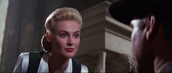 Movie still from “Indiana Jones and the Last Crusade” (1989), directed by Steven Spielberg – A person wearing a dress; Close Up shot, Over the shoulder angle