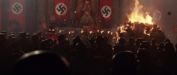 Movie still from “Indiana Jones and the Last Crusade” (1989), directed by Steven Spielberg – A crowd of people in nazi garb in front of a building; Wide shot, High angle