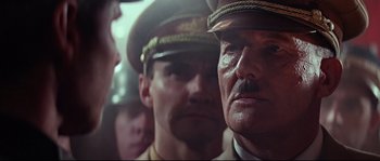 Movie still from “Indiana Jones and the Last Crusade” (1989), directed by Steven Spielberg – A man in a military uniform and a man in an army uniform; Close Up shot, Low angle