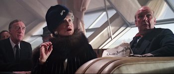 Movie still from “Indiana Jones and the Last Crusade” (1989), directed by Steven Spielberg – An older woman wearing a black hat and a fur coat; Close Up shot, Low angle