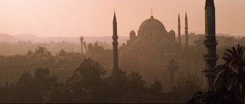 Movie still from “Indiana Jones and the Last Crusade” (1989), directed by Steven Spielberg – An image of a mosque in the middle of the day; Extreme Wide shot, Low angle